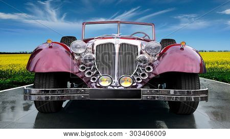 Russia. Rostov region. 25.05.2019 . Old, retro luxury car 1934 model year. Classic style of the mid 20th century. Parked in nature overlooking beautiful green fields.