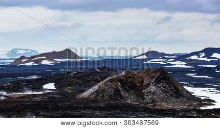 Panoramical view of Reeky lavas field in the geothermal valley Leirhnjukur, near Krafla volcano, Iceland. Landscape photography
