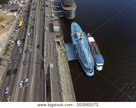 Embankment and river-boats early morning at spring. Downtown (drone image). May 28, 2019. Kiev,Ukraine