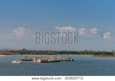 Benoa Harbour, Bali, Indonesia - February 26, 2019: Cluster Of Green And Red Fishing Vessels Anchore