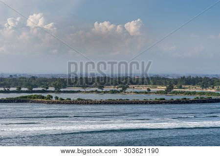 Bali, Indonesia - February 25, 2019: Ji Pantai Serangan Coastline North Of Benoa Harbour Entrance. B