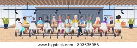 Businesspeople Group Brainstorming Sitting At Round Table During Conference Meeting Mix Race Coworke