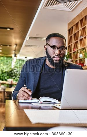 The Best Project Youll Ever Work On Is You. African American Businessman Is Working, Using His Lapto