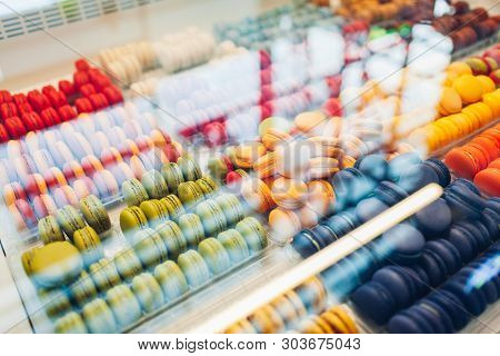 Assortment Of Colorful Macaroons On Cafe Showcase. Variety Of Macaron Flavours. Sweet Almond Cakes I