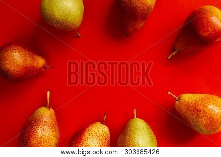 Yellow-red Pears On A Colored Background. Vitamins, Organic Products, Autumn Harvest, Vegetarianism,