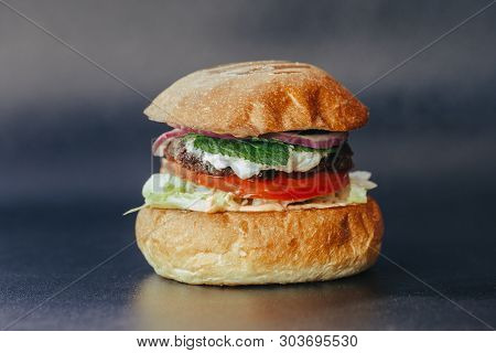 Burger Flyer. Cheese Burger With Grilled Meat, Cheese, Salad And Onion Rings. Close-up Of Delicious 