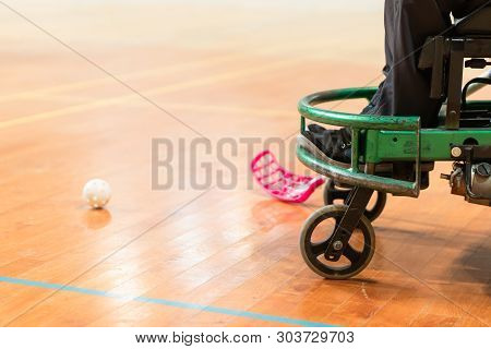 Disabled Man On An Electric Wheelchair Playing Sports, Powerchair Hockey. Wheelchair And Amputee Spo