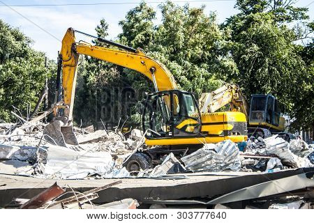 Stones, Destroyed Buildings, Building. Demolition. A Pile Of Stones. Crane