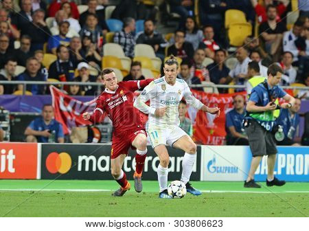 Kyiv, Ukraine - May 26, 2018: Andy Robertson (l) Of Liverpool Fights For A Ball With Gareth Bale Of 