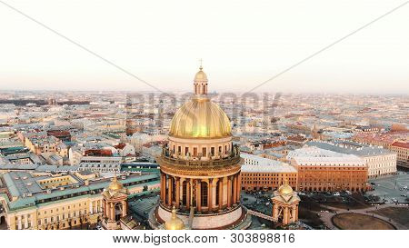 Drone Rises Above St. Isaacs Cathedral In The Historical Center Of St. Petersburg At Sunset