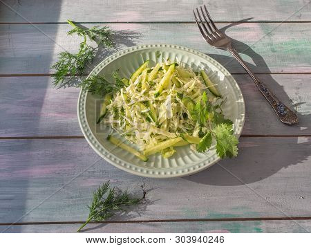 Very Light Vegan Salad With Fresh Katusta And Cucumbers With Spicy Herbs On A Round Lettuce Plate On