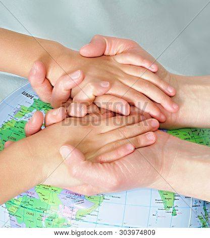 Hand With Globe Of The World Stock Photo