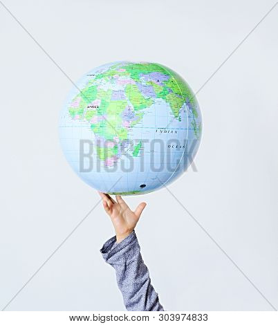 Hand With Globe Of The World Stock Photo