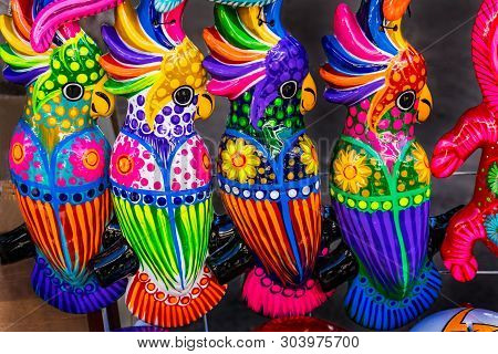 Colorful Blue Pink Yellow Ceramic Parrots Oaxaca Juarez Mexico.  Many Ceramic Factories Throughout T