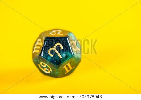 Astrology Dice With Zodiac Symbol Of Aries Mar 21 - Apr 19 On Bright Yellow Background