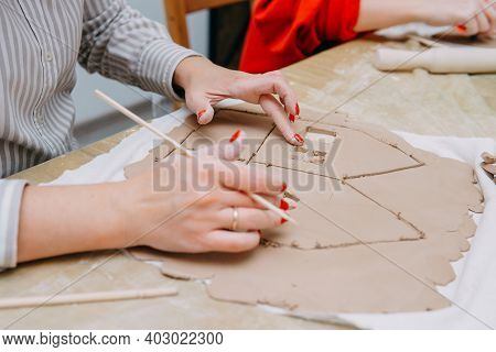 Womens Hands Knead Clay, Drawing Elements Of The Product. Production Of Ceramic Products At The Mast