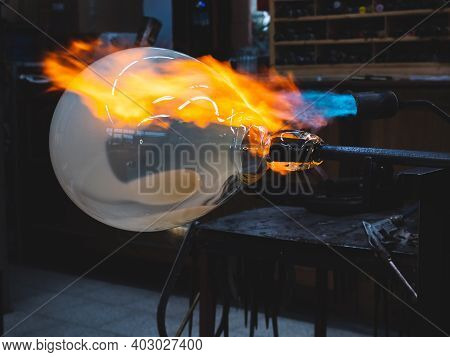 Creating Traditional Glass Art With Hot Torch And Glassblowing Pipe.  Creating The Heavy Glass Bowl 