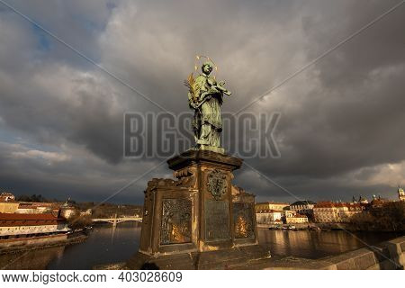 Prague, Czech Republic. 01-11-2021. Statue Of John Of Nepomuk On Charles Bridge By Mathias Rauchmull