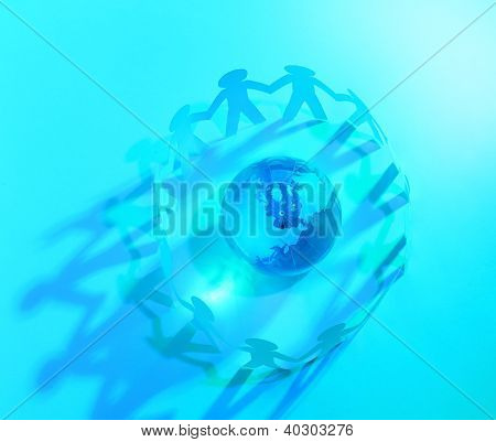 Paper People Standing In A Circle Around Glass Globe