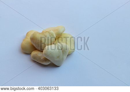 Peeled Water Chestnut Or Eleocharis Dulcis Fruit Isolated On White Background With Copy Space For Te