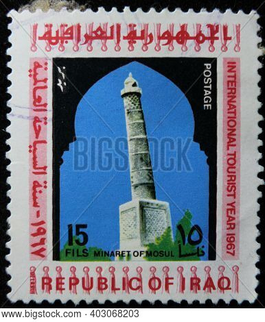 Istanbul, Turkey - December 26, 2020: Iraq Stamp Shows Minaret Of Mosul Circa 1967