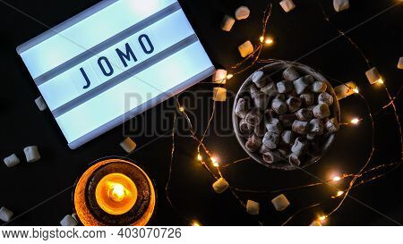 Lightbox With Text Jomo Joy Of Missing Out. The Concept Of Relaxation From Information And Gadgets.