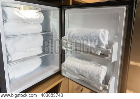 New Fresh Cooled Towels Stacked In Fridge At Gym Fintess Club For Person Refreshment While Workout E