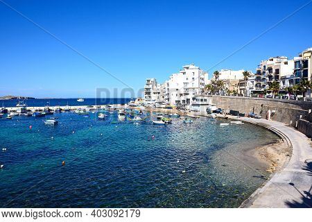 San Pawl, Malta - April 2, 2017 - Traditional Maltese Dghajsa Fishing Boats Moored In The Harbour Wi