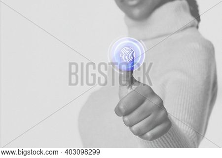 Woman scanning fingerprint with futuristic interface smart technology