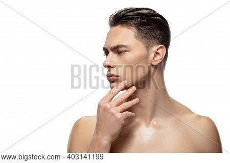 Thoughtful. Portrait Of Young Man Isolated On White Studio Background. Caucasian Attractive Male Mod
