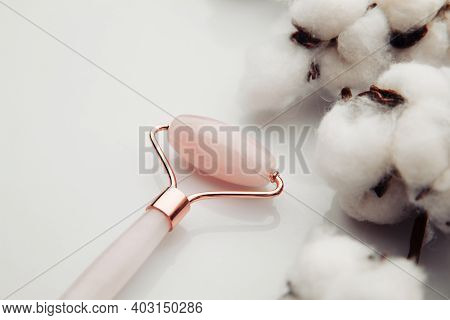 Pinl Jade Roller For Face Massage Close-up. Anti Age, Lifting And Toning Treatment