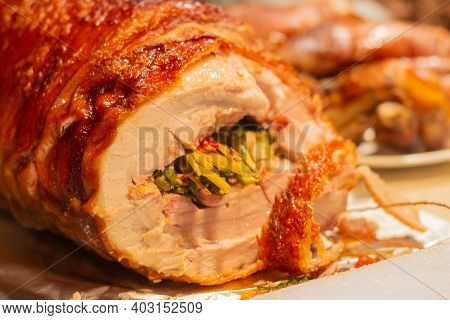 Roasted Pork Belly Lechon Stuffed With Herbs. Traditional Philippines Cuisine.