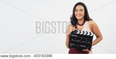 Asian Sexy Woman Hold Black Clapper Board Or Movie Slate Isolated On White Background.she Have Tan S