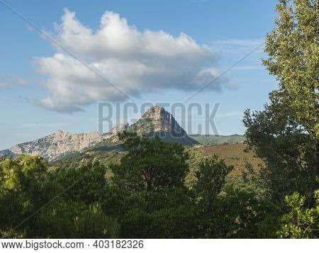 View Of Limestone Mountain Monte Oseli Over Green Tree Forest In Ogliastra, Urzulei, Sardinia, Italy
