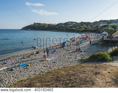 Porto Frailis, Arbatax, Sardinia, Italy, September 9, 2020: Group Of People Relaxing At Sand Beach P