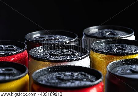 Metal Energy Drinks Cans On Black Background With Water Drops, Copy Space