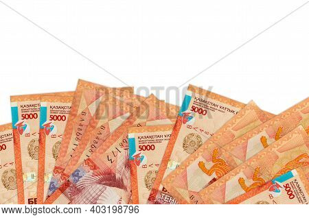 5000 Kazakhstani Tenge Bills Lies On Bottom Side Of Screen Isolated On White Background With Copy Sp