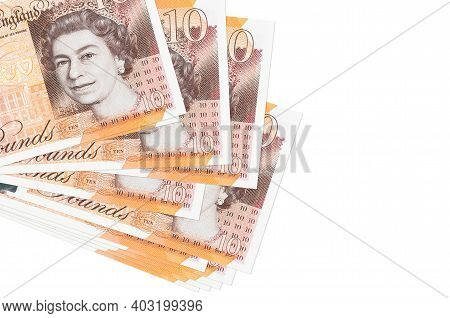 10 British Pounds Bills Lies In Small Bunch Or Pack Isolated On White. Mockup With Copy Space. Busin