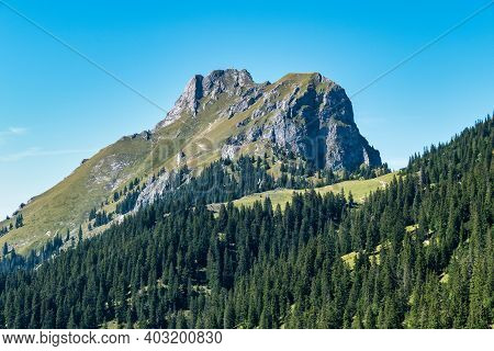 View To The Famous Mountain Red Flueh And Gimpel In The Valley From Tannheim In Austria.