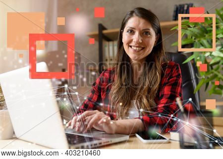 Woman Surfs In Internet With Her Laptop. She Work At Home As Smart Working