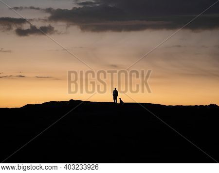 Sunset Panorama Of Hiker With A Dog On Marcahuasi Andes Plateau Rock Formations Mountain Nature Land