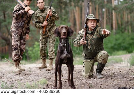 Wildfowl Hunting Excited Man With Rifle And Dog.
