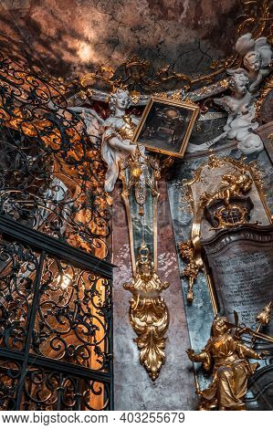 Feb 2, 2020 - Munich, Germany: Angel Statue On Ceiling Holding Painting In Asamkirche Church