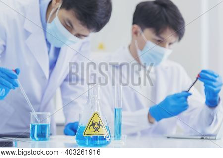 Two Asian Scientist Team Reserch Chemistry Science Tube Experiment Biotech Antibody Sample In Labora