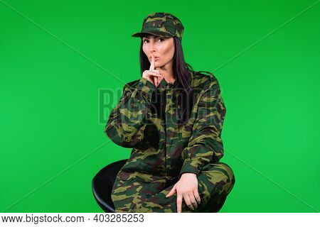Serious Young Woman In Military Uniform Shows Quietly Tsss With Finger To The Mouth, Looking At The 