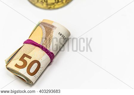 Metal Piggy Bank With Euro Symbols For Saving Money. On A White Background With Euro Banknotes. Savi