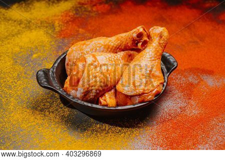 Top View.convenience Food,pree Cookedmarinated Chicken Drumstick On Black Ceramic Round Roasting Pla