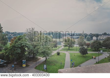 Krakow, Poland - October, 2015: View From Wawel Royal Castle On The Park And The Vistula River In Wa
