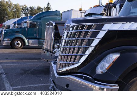 Resting Place. Various Types Of Trucks In The Parking Lot Next To The Motorway.