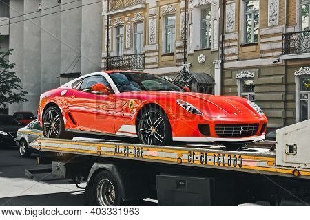 Kiev, Ukraine - May 12, 2012: Red Supercar Ferrari 599 Alonso Edition 60f1 In The City. Car On A Tow